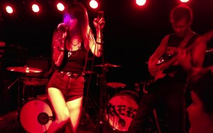 The Devil (the band, not the ruler of the dar) soak up the orange stage lights at The Riot Room.