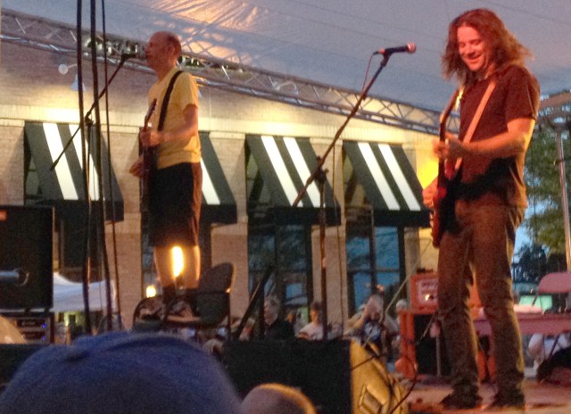 The Presidents of the United States of America perfroming live at the Sunset Music Fest at Town Center Plaza in Leawood, Kansas. Lead singer Chris Ballew (left) performs their song "Dune Buggy" from on top of a chair simply because he is a rock star and can do that sort of thing.