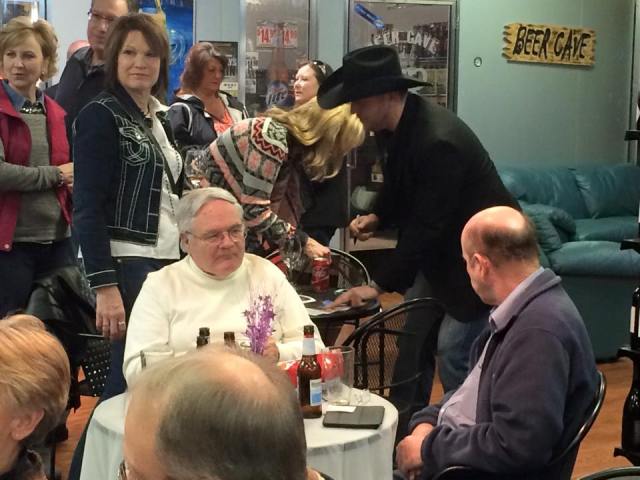 Phil Vandel signs copies of the Tuning Fork magazine he was on the cover of for February 2015.